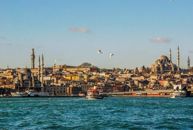 City buildings near body of water during daytime photo