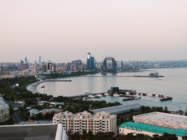 city skyline under white sky during daytime photo